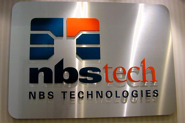 Acrylic panel with brushed stainless steel metal finish and 3D lettering for wall mounted lobby sign