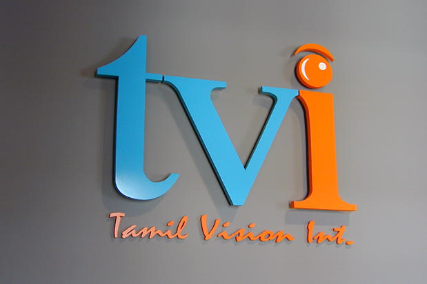 Dimensional acrylic signage letters as part of reception area lobby sign - Tamil Vision Int. - Art Sign Company