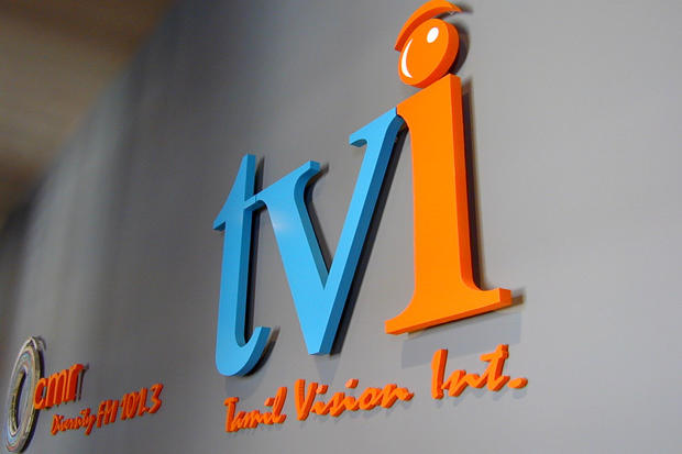 Custom corporate acrylic lobby signage for business reception area - Tamil Vision Int. - Art Sign Company