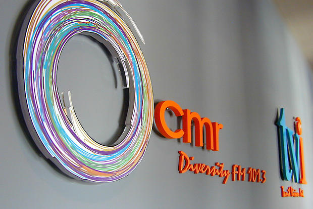 Tamil Vision Int. laser cut custom acrylic lobby signs in reception area - Art Sign Company