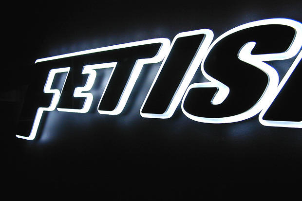 Glowing edges on LED illuminated night club lobby sign made with laser cut acrylic signage lettering