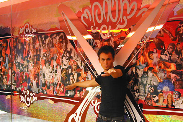 Installer next to wall mounted laser cut mirror decor in night club