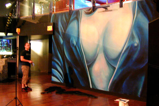 Painted female wall mural, backdrop for decorative mirror female figures outlines of mud flap girls at Circa night club in Toronto