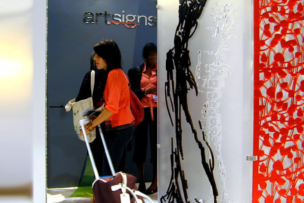 Interior designers looking at decorative laser cut mirror screen - Art Signs Company