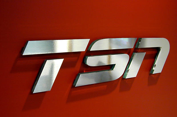 TSN office lobby signage made with metal laminate on clear acrylic letters raised in business boardroom area - Art Signs Company