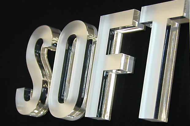 Frosted laser cut acrylic office signage lettering for dimensional letter sign in business lobby area made by Art Signs Company