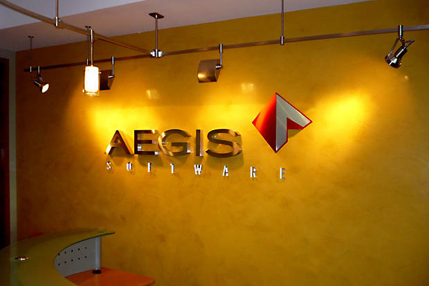 Halogen spot lights illuminating 2" deep stainless steel metal reception lobby signage made by Art Signs Company