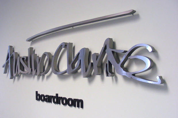 Decorative metal 3D corporate office lobby signage raised off reception area wall