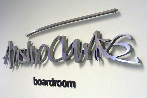Board room lobby signage made with raised laser cut metal sign lettering for Canadian Heritage, Austin Clark. Sign made by Art Signs Company