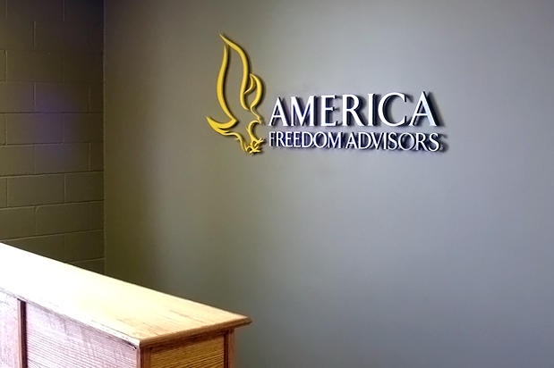 3D metal office logo signage installed on corporate business office lobby reception wall. Made by Art Signs Company