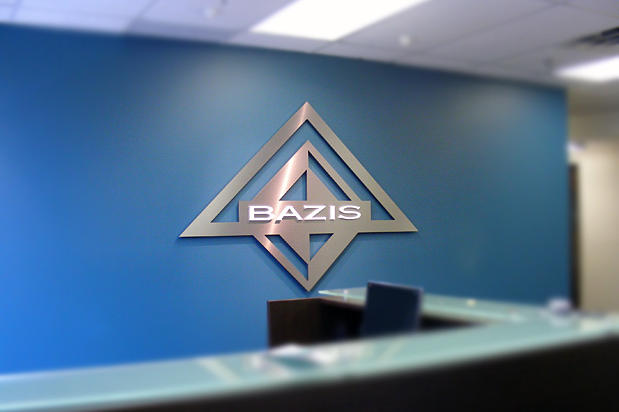 Business signage product with custom lettering and logo display on office reception wall made by Art Signs Company