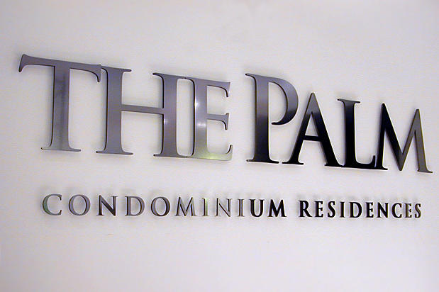 The Palm condo lobby signs made with brushed metal finish to simulate stainless steel or nickel