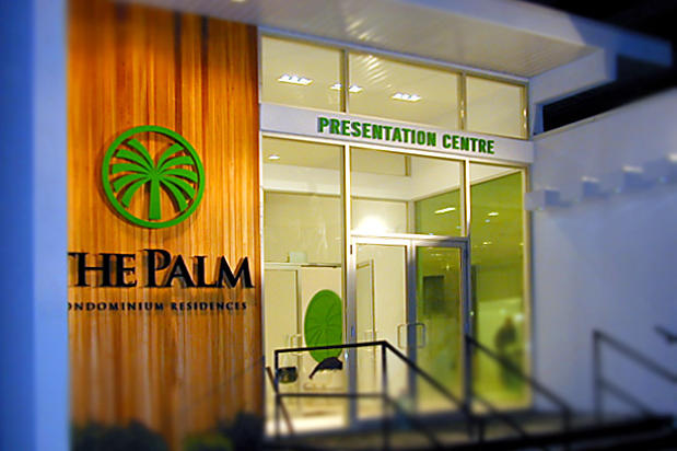 The Palm Condominiums Presentation Center front door signage raised off wall by Art Signs Company