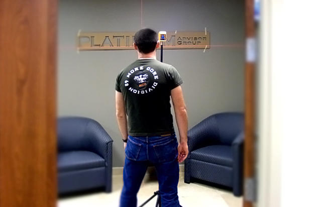 Art Signs Company signage installers levelling installation pattern for office lobby sign letters on reception area feature wall