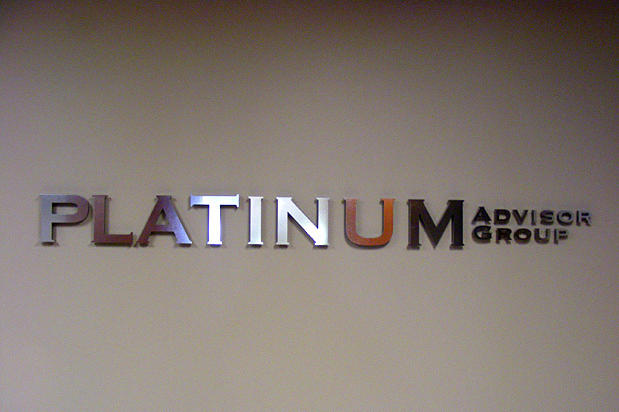 Platinum Advisors Group 3D metal office lobby signage letters and logo raised off company reception area wall