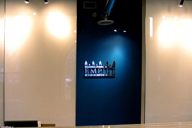 Mirror custom office signs acrylic lettering and logo in reception area