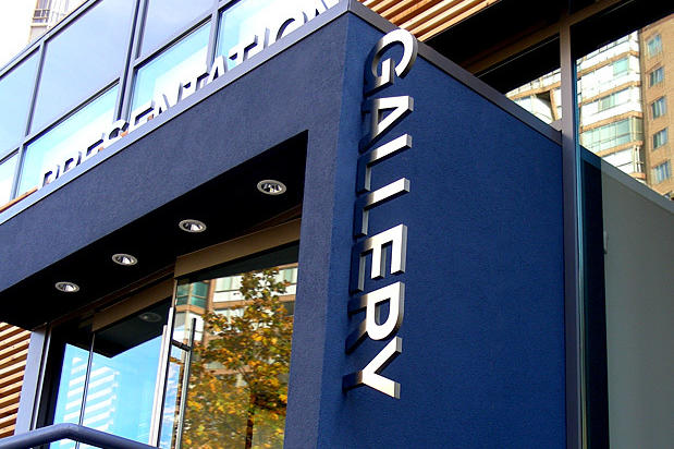 Exterior metal corporate business signage for condo sales center and show room made by Art Signs Company