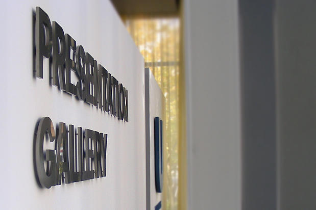 3d corporate business lobby sign letters raised off reception area wall on spacers