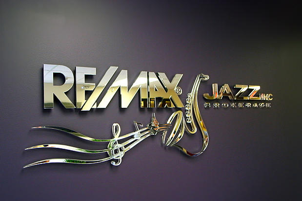 Mirror 3d sign for jazz remax in lobby reception area designed made, and installed by Art Signs Company