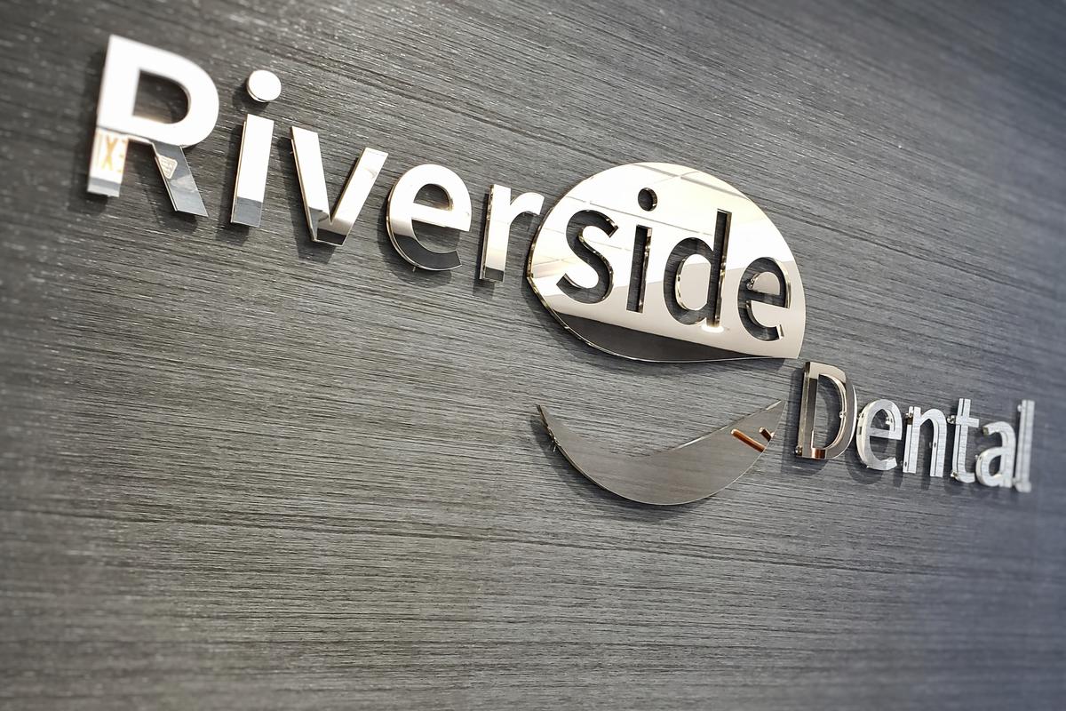 Mirror sign design in dental office waiting room for Riverside Dental
