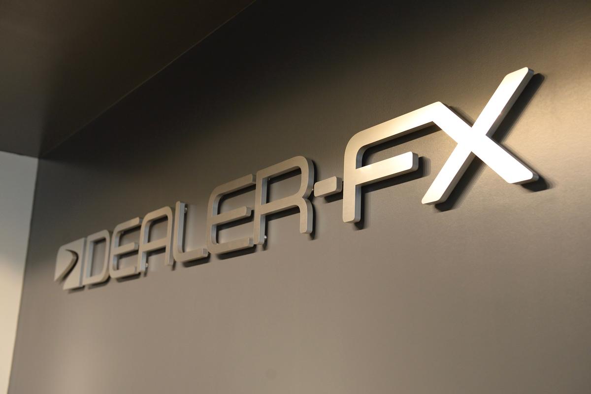 Dealer-FX office reception signage reflects light from Halogen LEDs