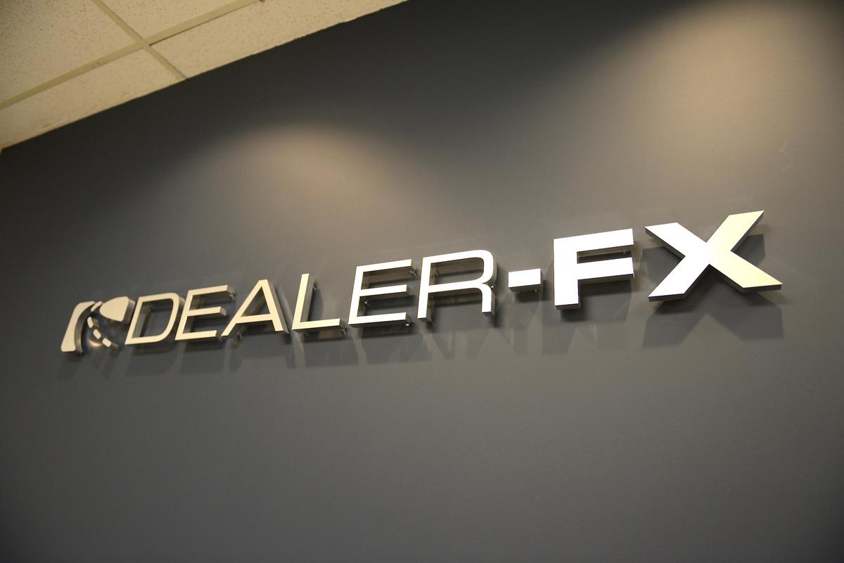 2014 Dealer-FX signage mounted on office wall in Toronto