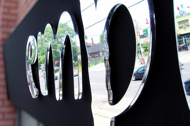 Mirror sign with acrylic dimensional lettering
