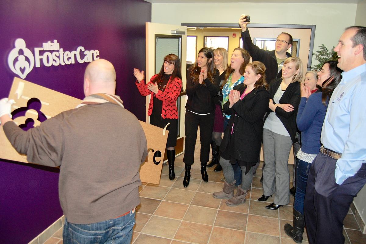 Customers easily installing reception wall signage