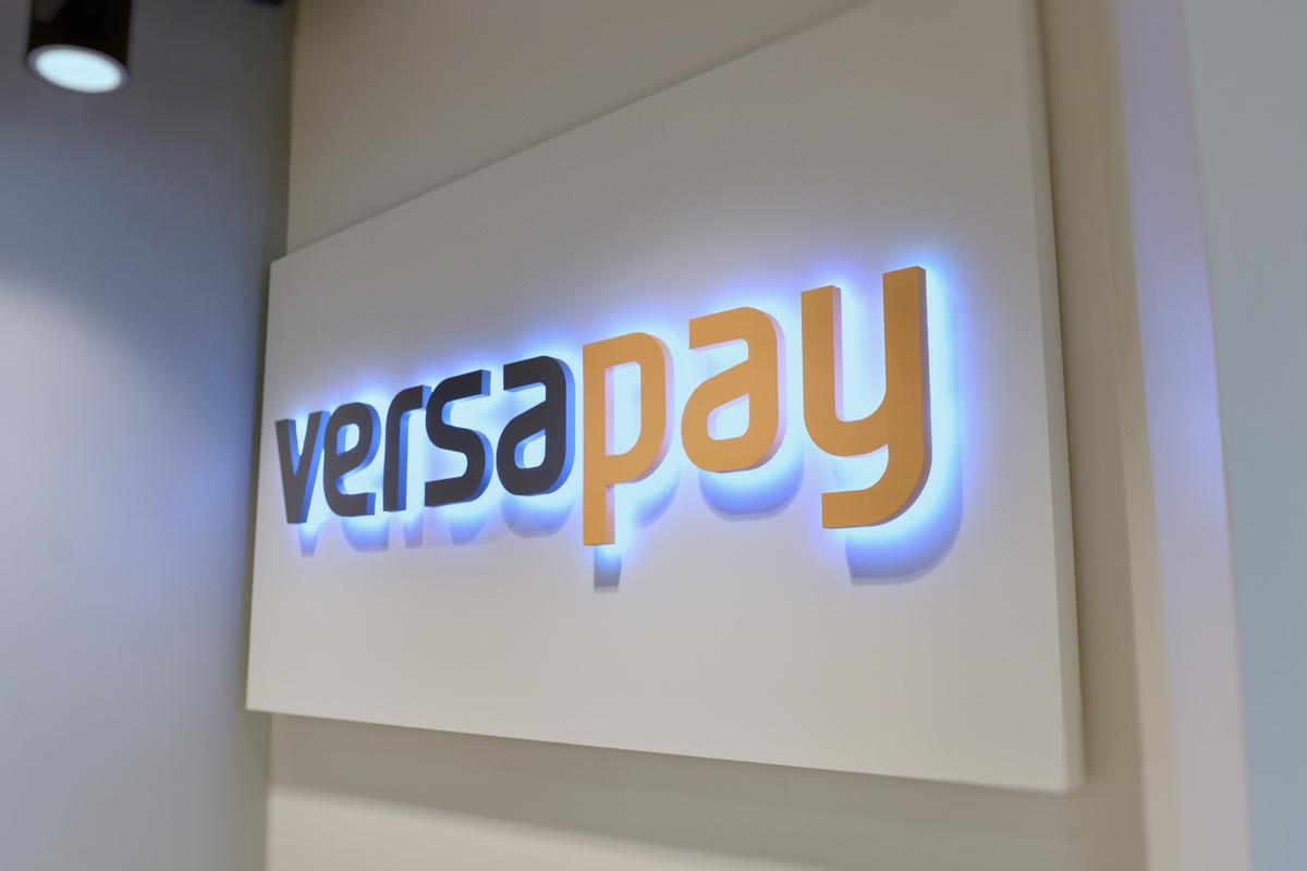 Raised backlit dimensional letters mounted to custom panel