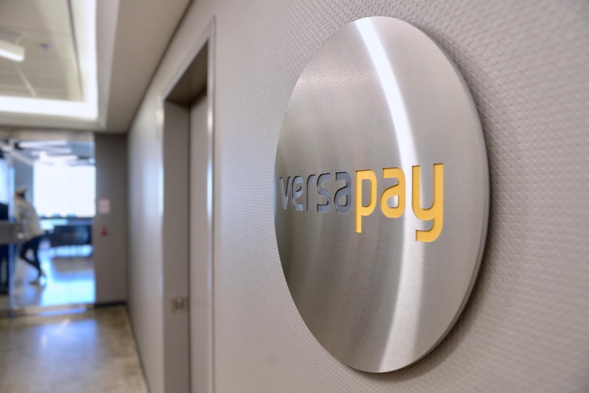 Round brushed stainless steel panel sign with reverse cut letters