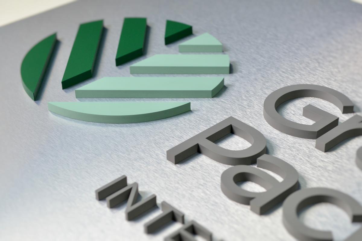 Brushed aluminum panel sign with dimensional acrylic letters