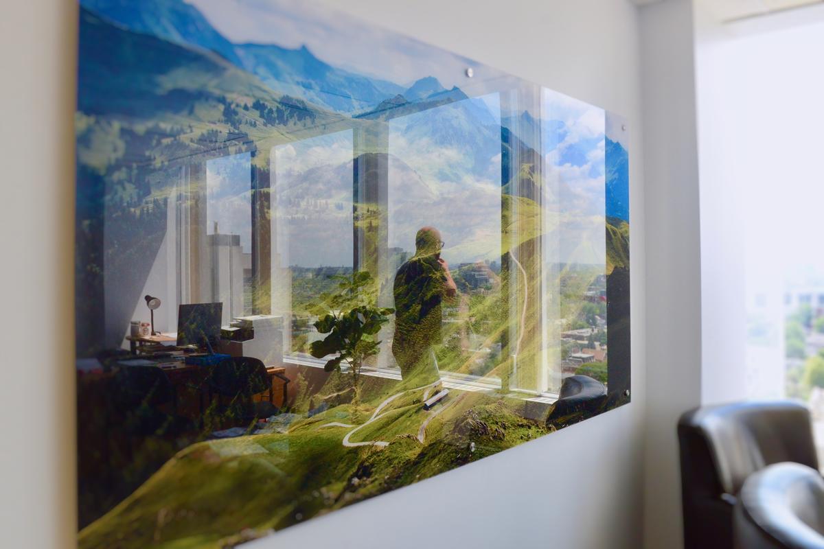 Wall mounted acrylic panel with printed landscape in corporate office