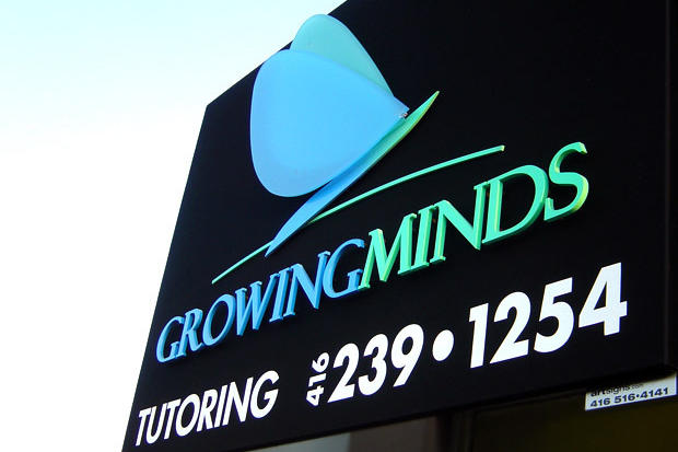 Outdoor office wall sign for retail business with dimensional acrylic letters raised off background