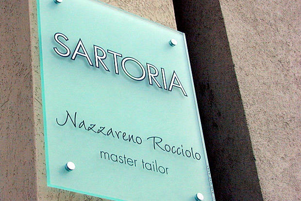 Acrylic Panel Sign with custom vinyl graphics installed with stainless steel decorative caps