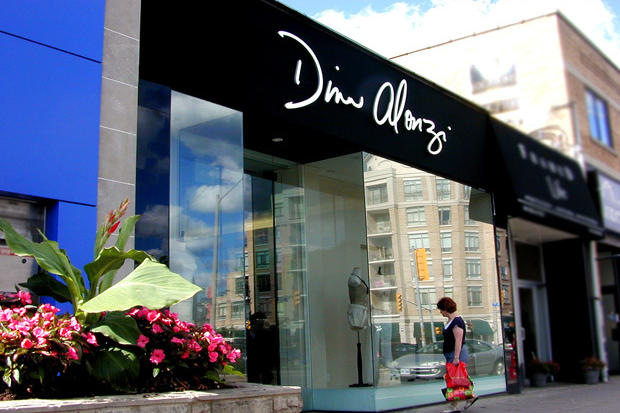 Retail store sign with brushed aluminum dimensional letters