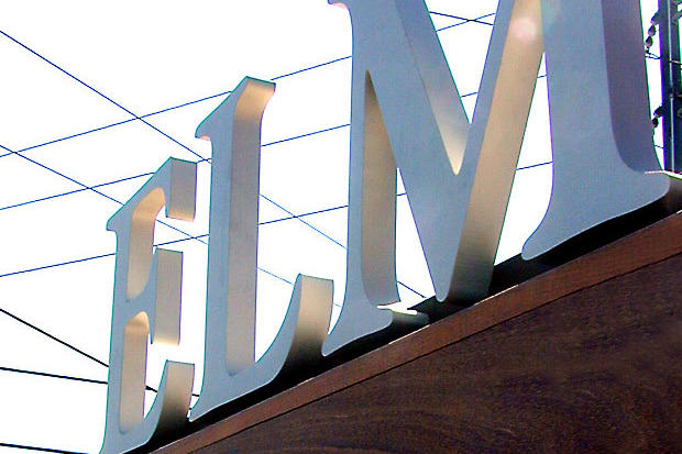 Free standing dimensional stainless steel metal letters as part of a corporate exterior sign