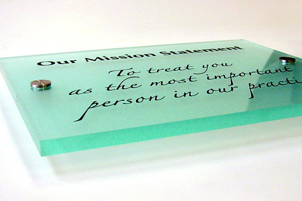 Green glass acrylic plate office sign with custom vinyl graphics