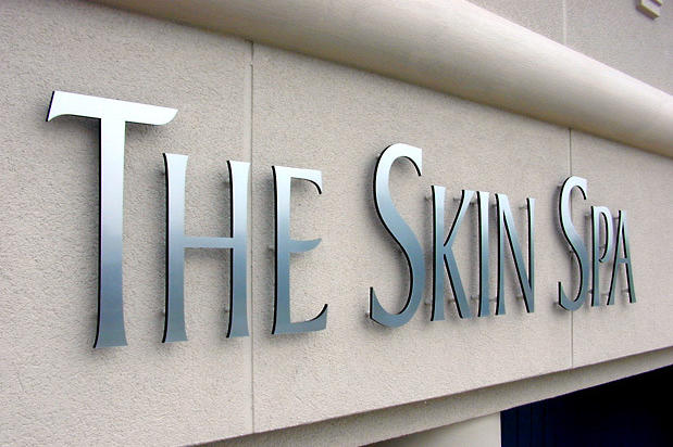 3D laser cut outdoor sign, brushed nickel metal finish and acrylic raised off exterior business wall in Oakville Canada