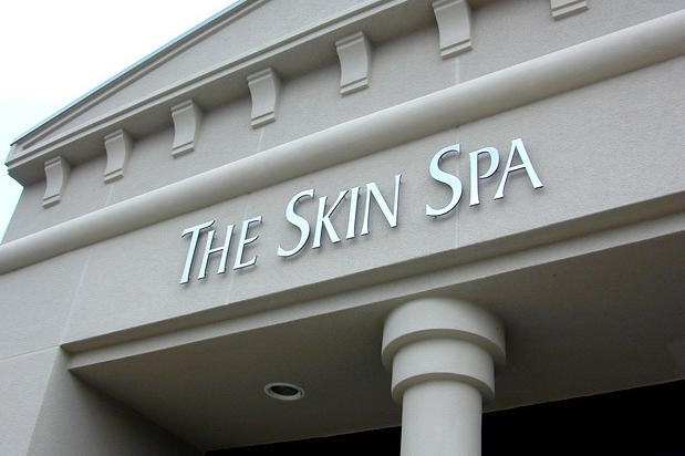 3D laser cut spa business sign, brushed nickel metal composite acrylic dimensional letters on bulkhead installed outside