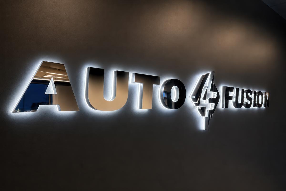 Custom 3D sign made of mirror chrome stainless steel with LED backlighting for Auto Fusion.