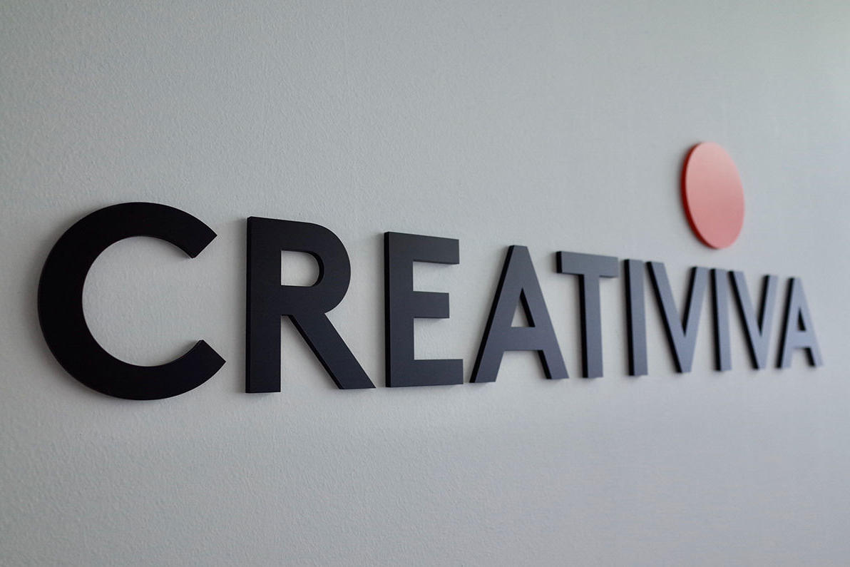 Acrylic letter sign with quarter inch letters painted to match and adhered directly to the wall.