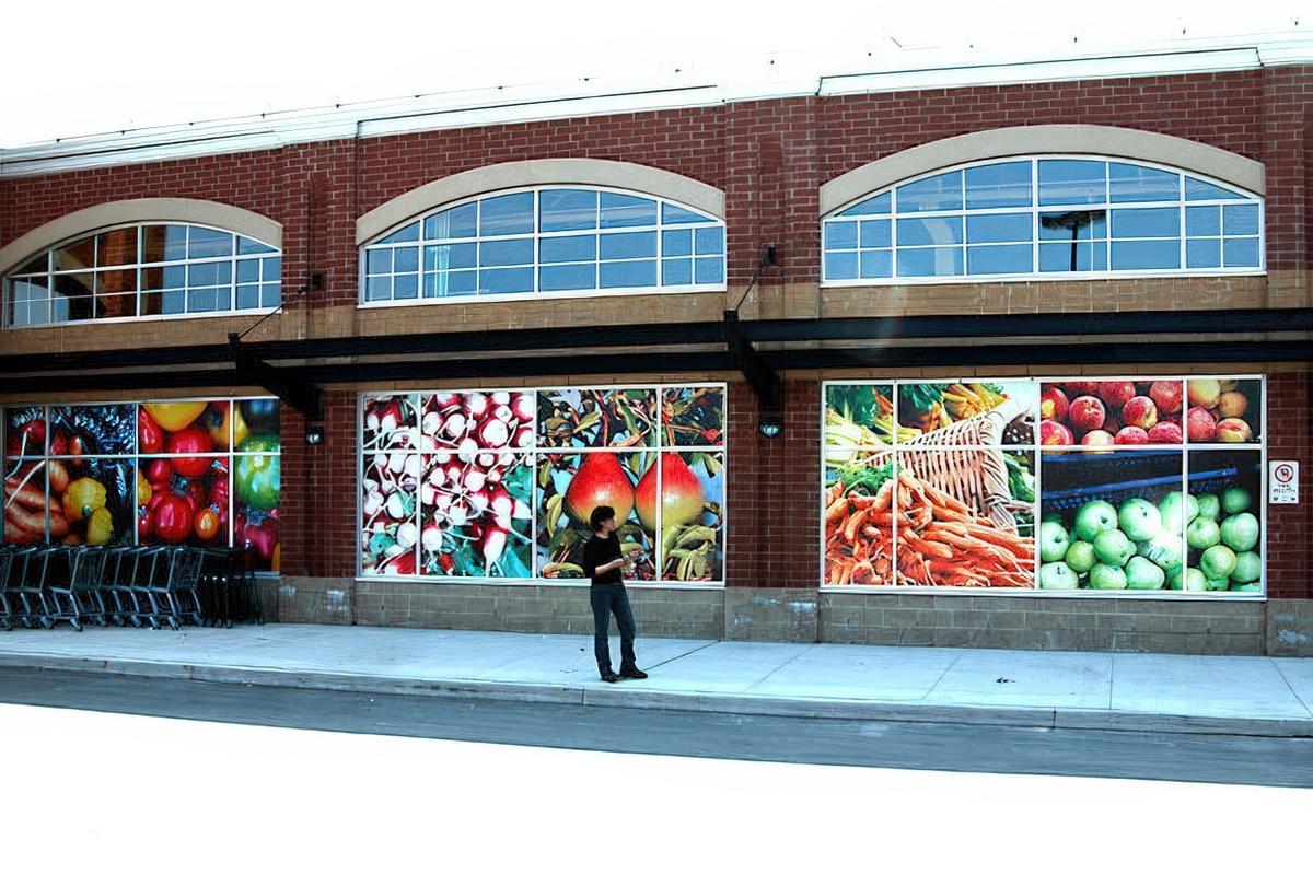 Exterior storefront window graphics for Whole Foods Oakville, creating a polished branded look with bold full-color visual appeal.