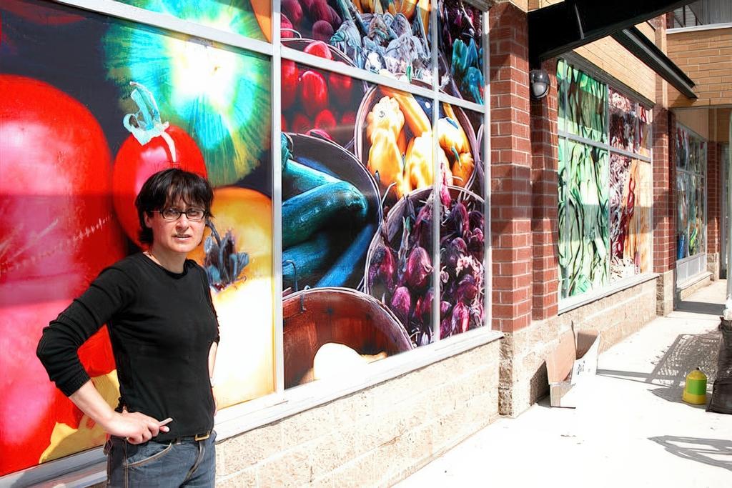 Large-format vinyl window graphics for Whole Foods Oakville, transforming plain storefront glass into a bold and eye-catching display.