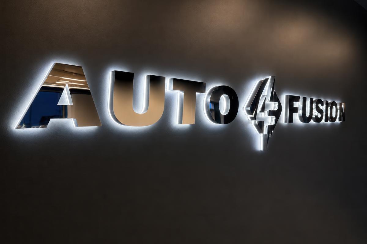 Custom 3D sign made of mirror chrome stainless steel with LED backlighting for Auto Fusion.