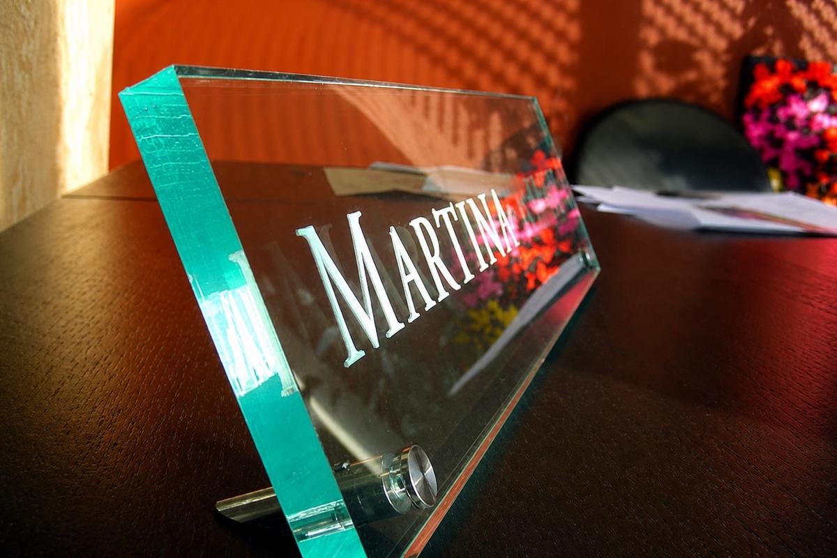 Side-angle ½-inch green-edge acrylic nameplate with deep engraving and steel bracket