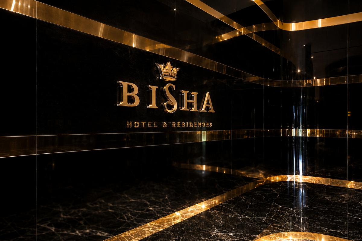 Bisha Hotel & Residences gold dimensional logo sign on a black-and-gold Toronto interior wall