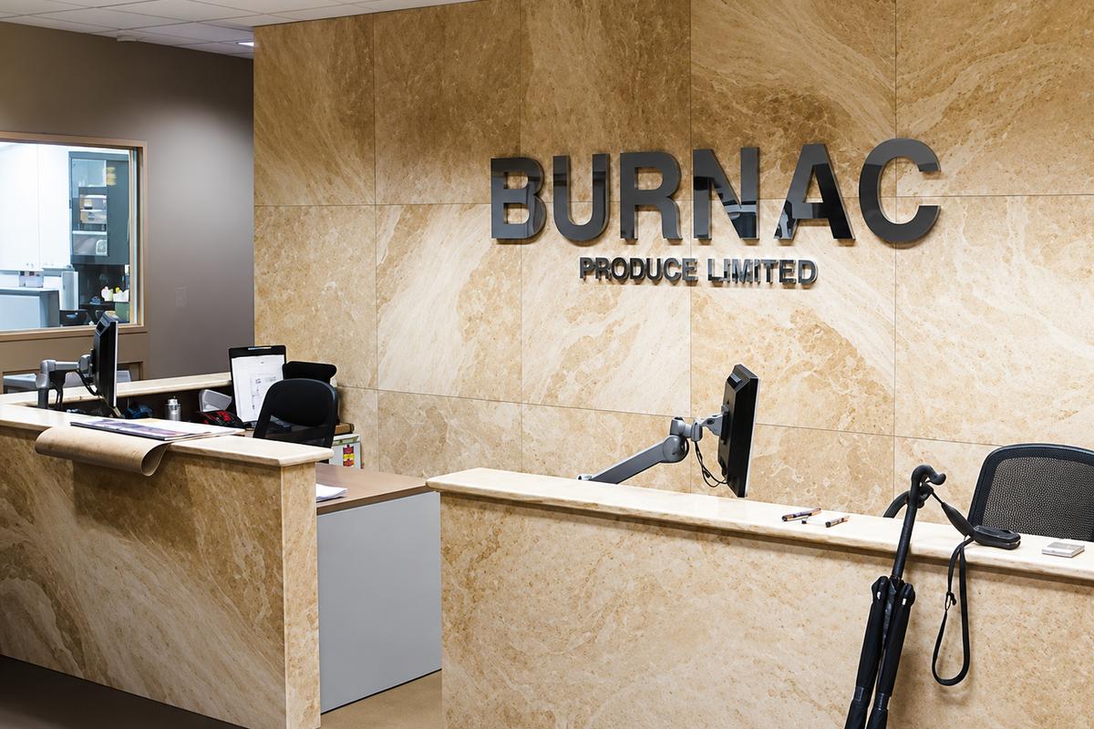 Burnac Produce Limited 3D polished aluminum office reception sign mounted on a marble wall with clear spacers