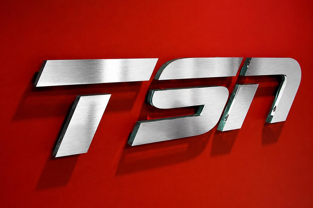 tsn-dimensional-acrylic-logo-red-wall boardroom area - Art Signs Company