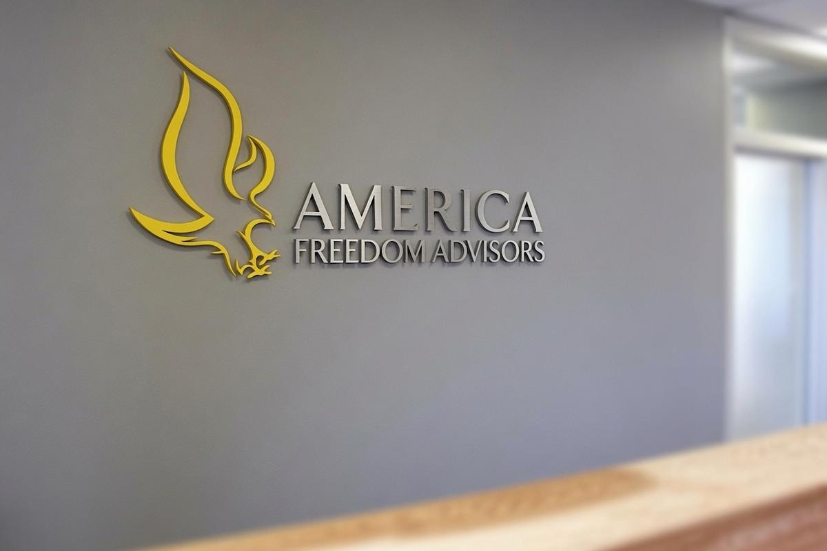 Wide view of the America Freedom Advisors dimensional logo behind a Tampa reception desk