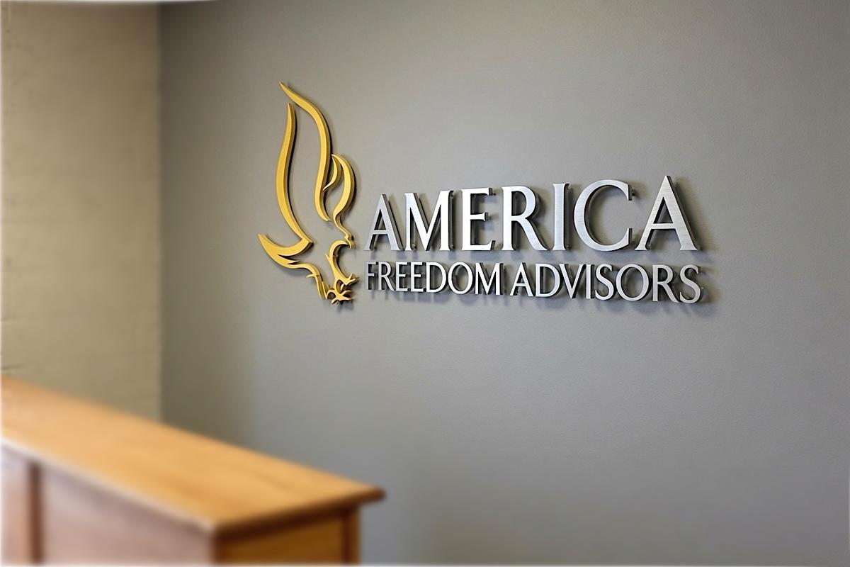 America Freedom Advisors brushed nickel logo sign on a Tampa office reception wall